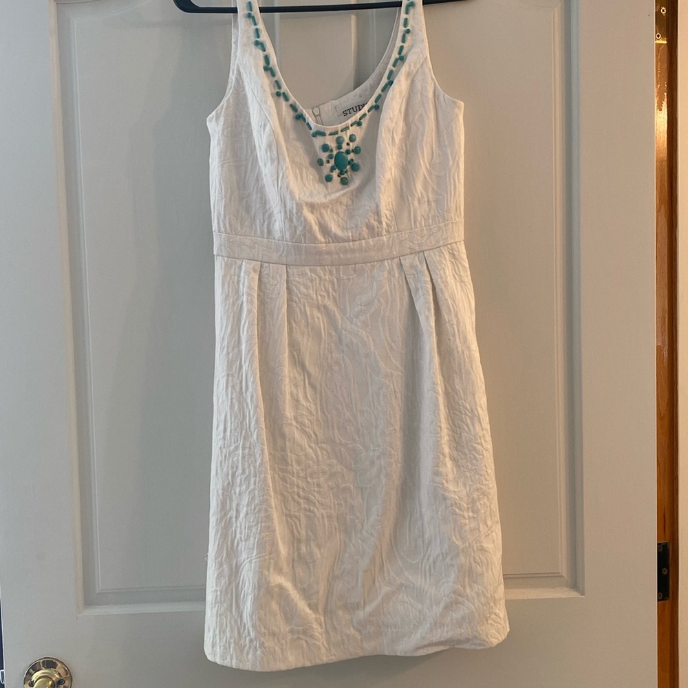 White dress with turquoise beads